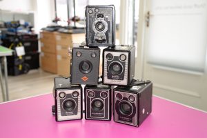 A stack of 6 box cameras