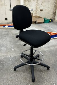 A black draughtman's chair in the basement